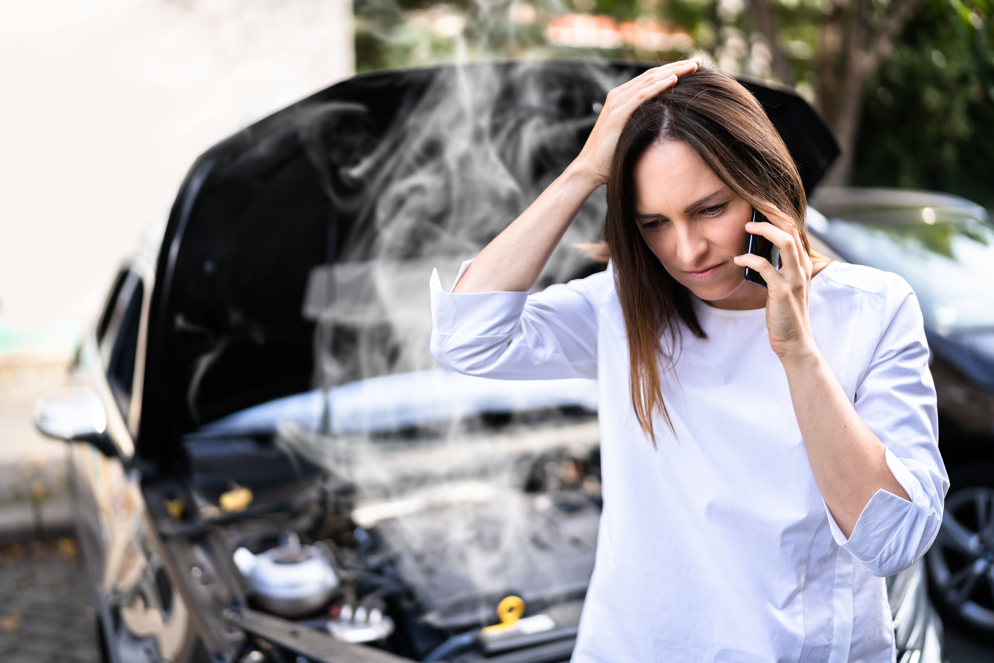 towing-insurance-woman-calling-roadside-assistance